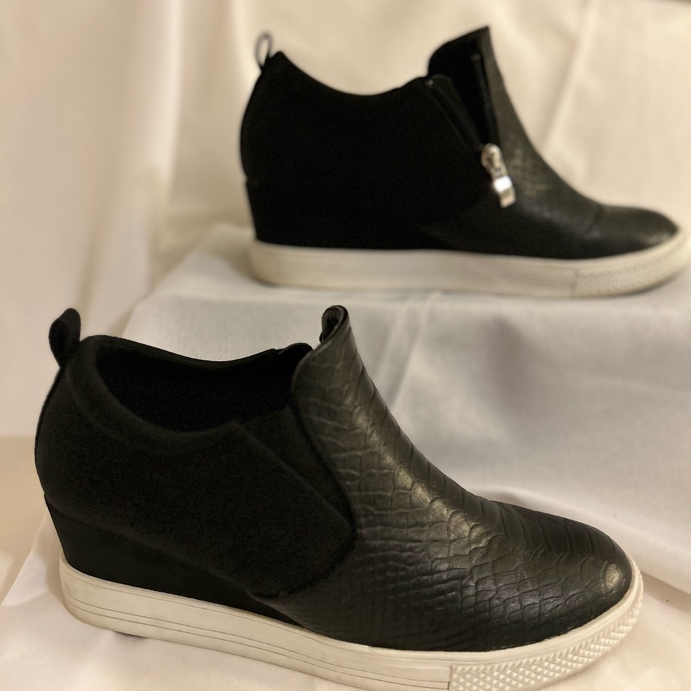 Black sneaker like wedge. Minimal wear. Women size 10